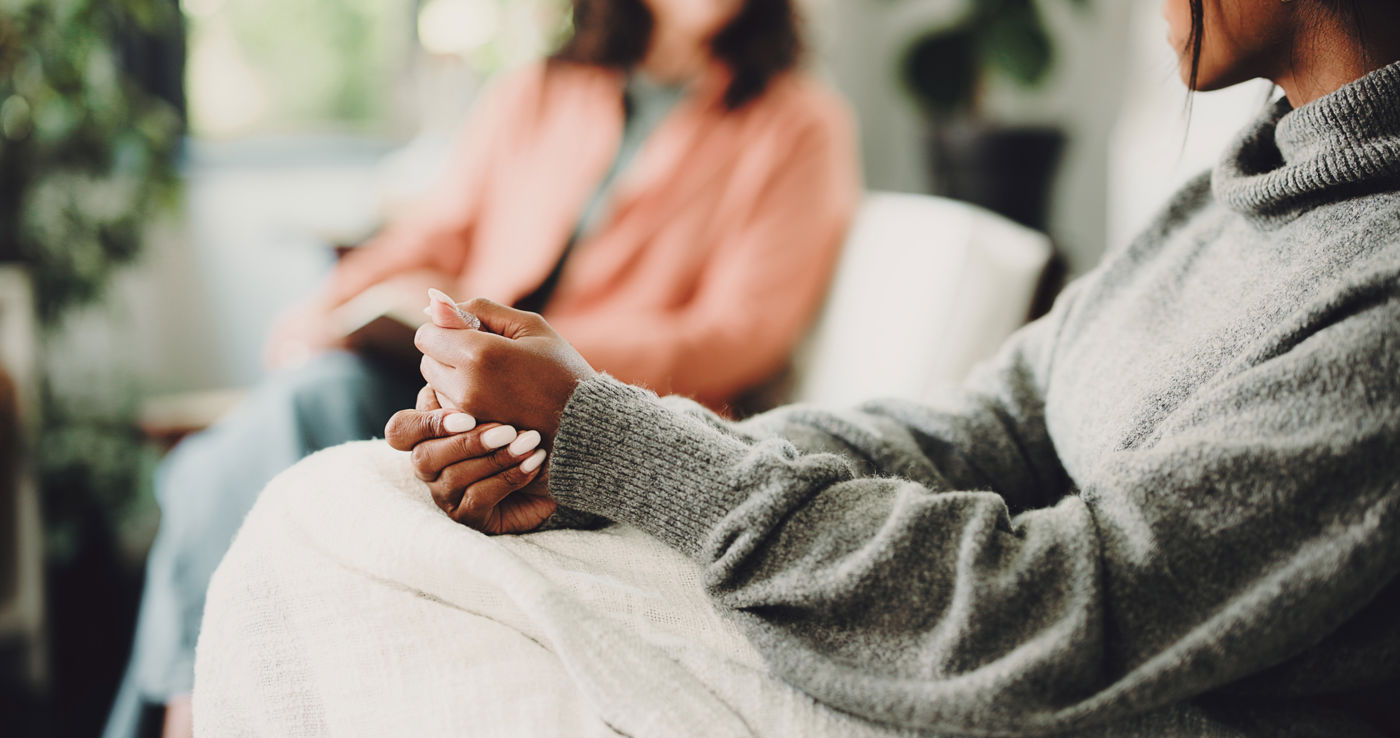 therapy-anxiety-hands-woman-sofa-counseling-assessment-support-mental-health-advice-progress-with-people-office-therapist-session-trauma-recovery-help-discussion.jpg